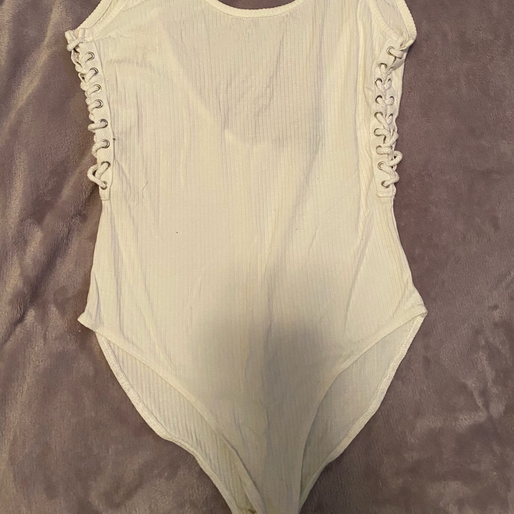 Side lace up size small white bodysuit